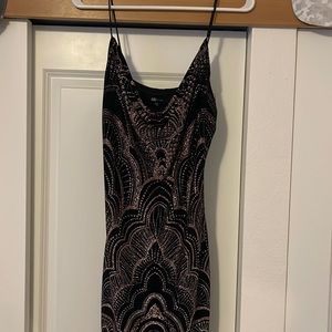 Little black bodycon mini dress with rose gold detailing